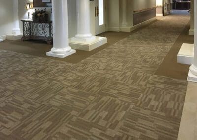 Lindin Design & Company | Spartanburg, SC | commercial design, carpeted hallway to reception