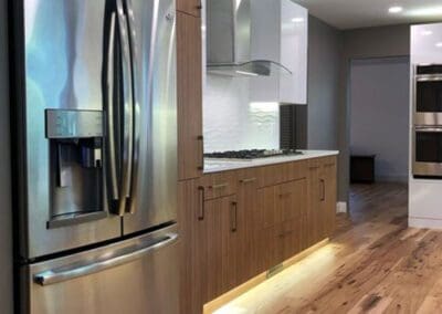 Lindin Design & Company | Spartanburg, SC | kitchen with wood cabinets, lighting, stainless steel appliances